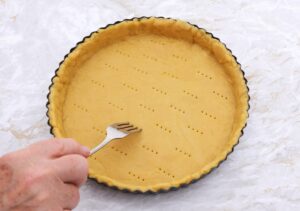 pricking holes in a pastry pie crust