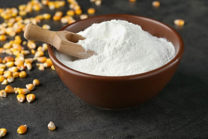 Bowl of corn starch and corn kernels